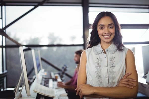 Indian female entrepreneur working on financial strategies in an office setting.